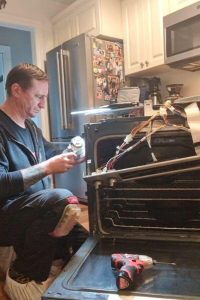 technician fixing kitchen range in jacksonville