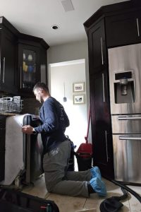 experienced technician doing dishwasher repair in jacksonville