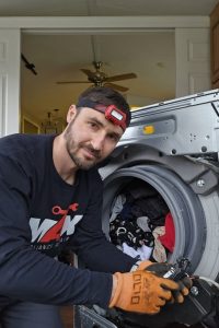 jacksonville technician repairing washer
